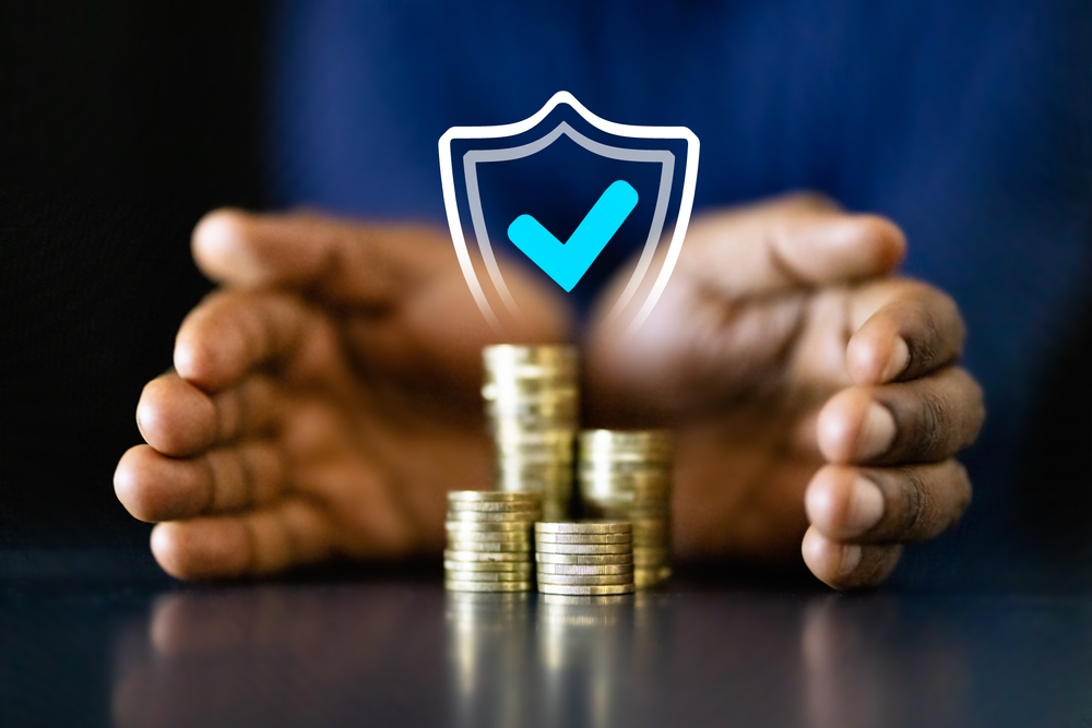 African,American,Businessman,Counting,Coins,To,Protect,Income,And,Invest