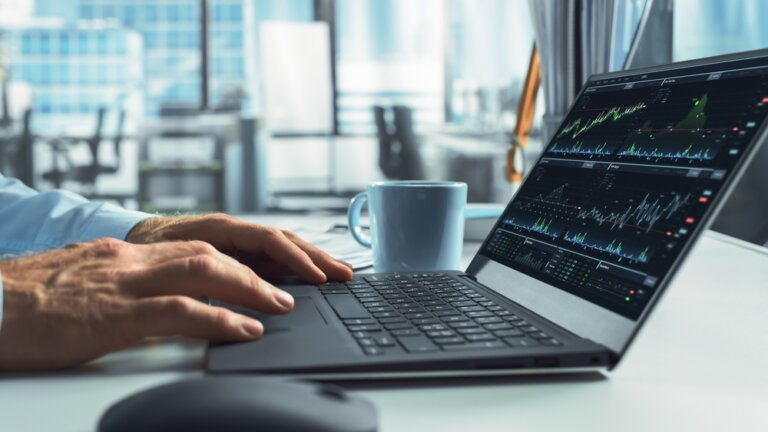 Close-up,On,Hands,Of,Professional,Financial,Analyst,Using,Laptop,Computer