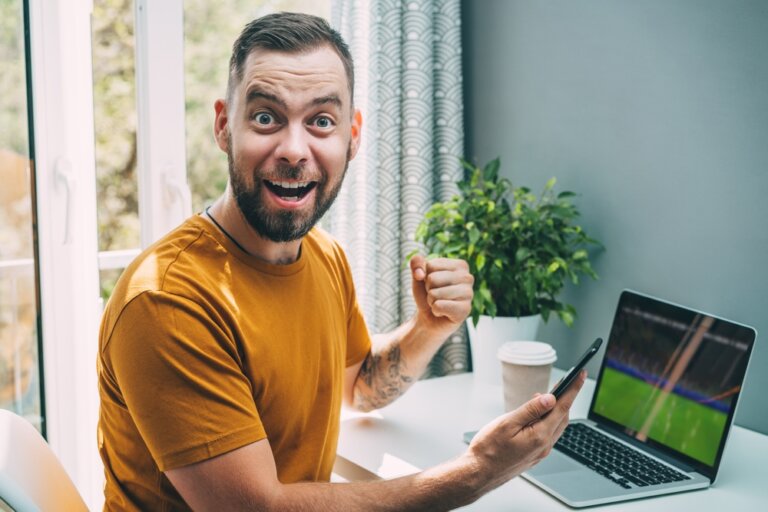 Lucky,Man,Celebrating,Victory,After,Making,Bets,At,Bookmaker's,Website.