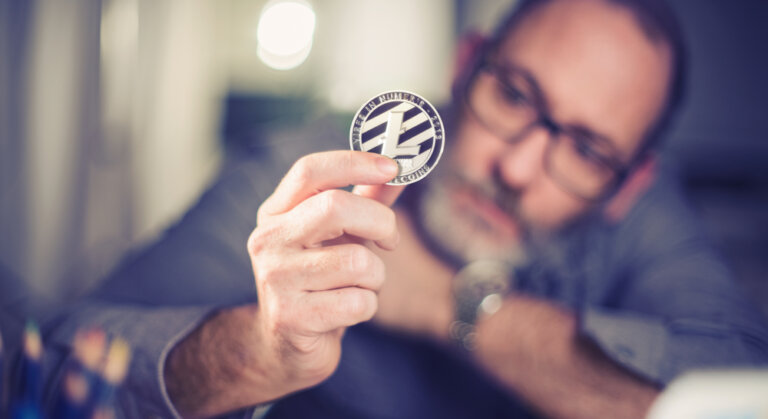Litecoins,-,One,Litecoin,Cryptocurrency,In,Hand,Of,A,Casual