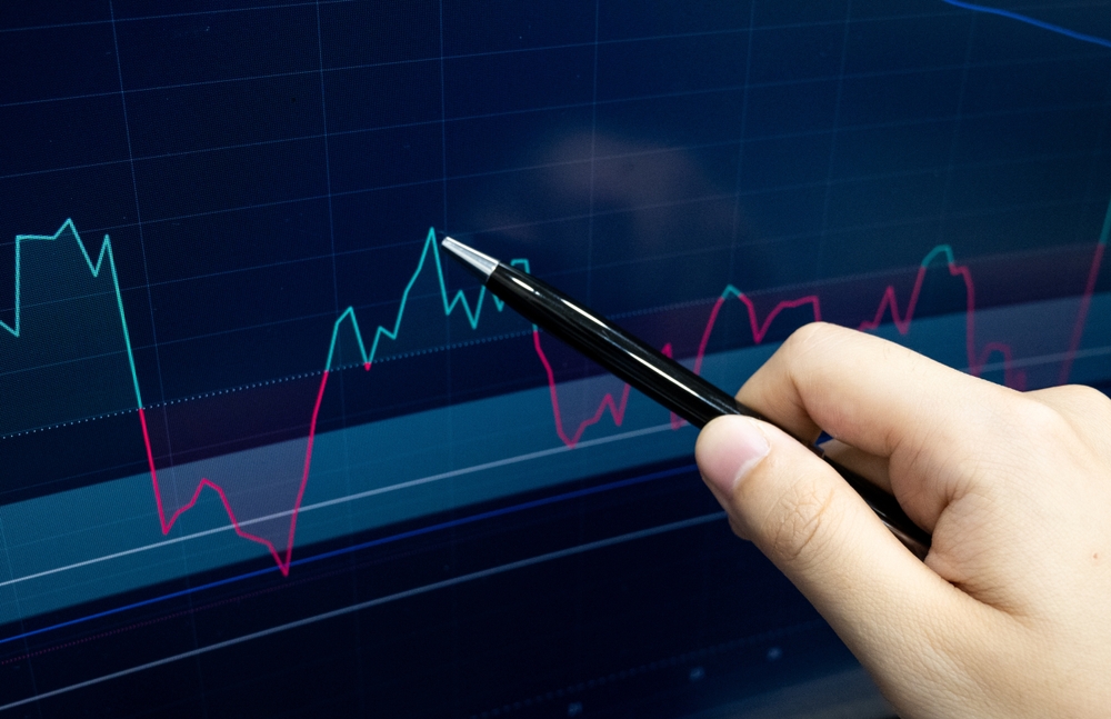Stock,Market.,Pointing,At,Screen,Analysing,Market,Trend,Line