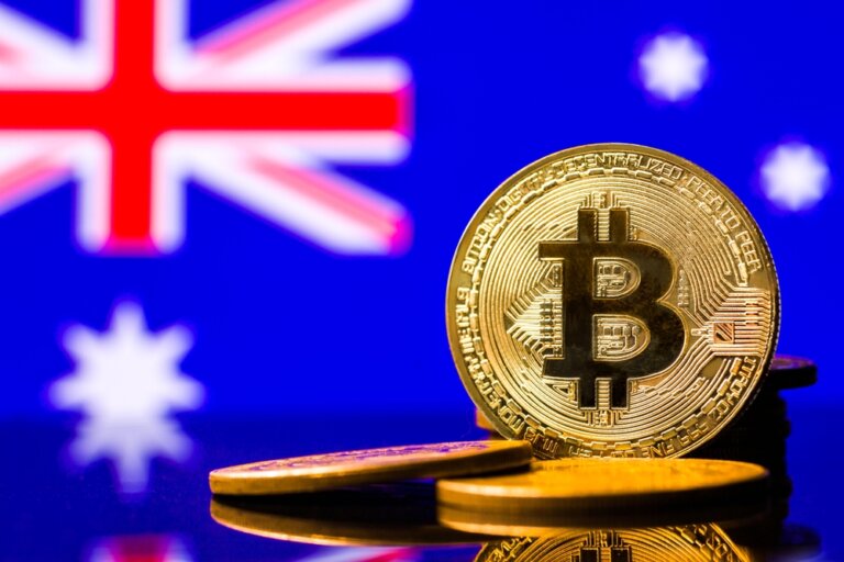 Gold,Metal,Coin,Bitcoin,On,The,Background,Of,The,Flag