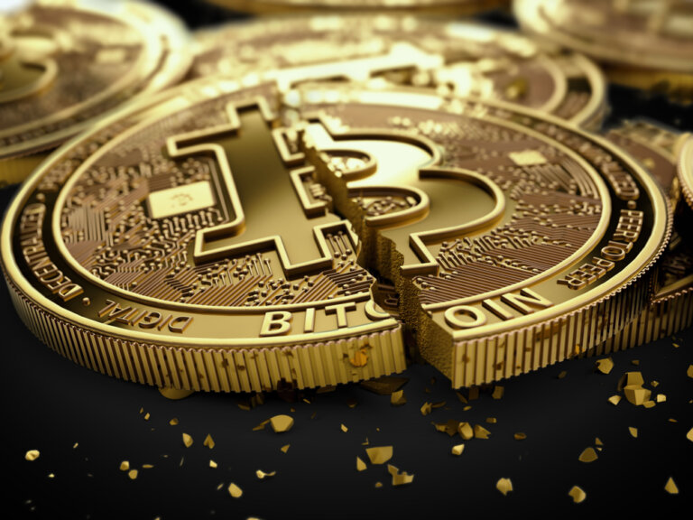 Close-up,Shot,On,Broken,Or,Cracked,Bitcoin,Coins,Laying,On