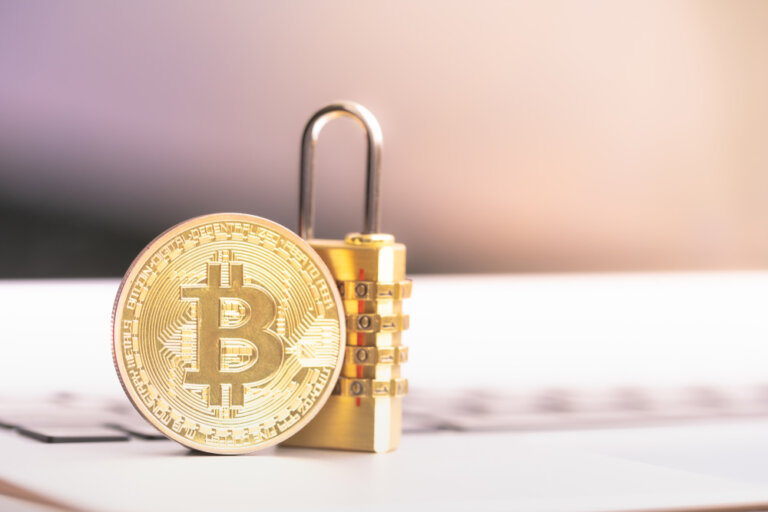 Bitcoin(btc),Coin,With,Padlock,Lying,On,Computer,Background.,Bitcoin,Security.