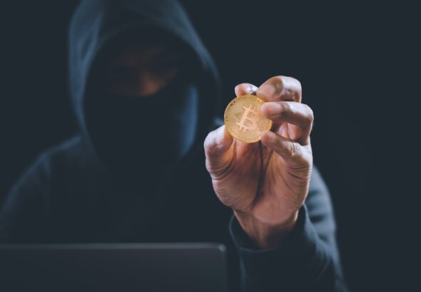 Crypto,Currency,Bitcoin,Holding,By,Hacker,From,Scam.