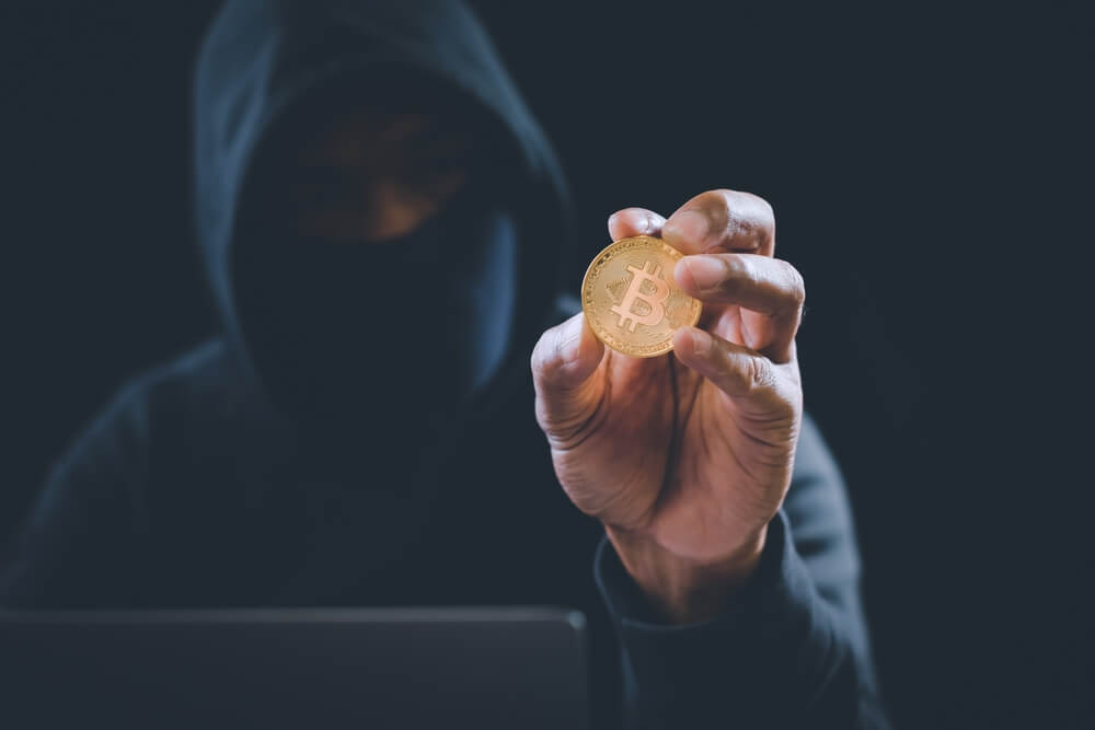 Crypto,Currency,Bitcoin,Holding,By,Hacker,From,Scam.