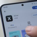 Hand,Installing,Xchat,At,Android,Smartphone.,Jakarta,,7,July,2025.